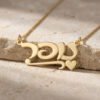 Personalized 14K solid gold Hebrew name necklace with heart resting on stone