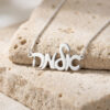 925 sterling silver custom Hebrew script name necklace on travertine stone