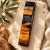 Handmade Israeli olive wood mezuzah case with gray epoxy accents and a silver Shin, styled on Jerusalem stone with olive leaves