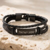 Jewish men's bracelet in black braided leather with a black nameplate engraved Shema Yisrael in Hebrew, on travertine stone