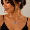 Woman wearing the Hebrew name necklace with Star of David, showing the pendant size on the neckline