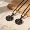 Black stainless steel compass necklace with