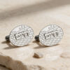 Custom Western Wall cufflinks with a raised Hebrew name on natural beige stone