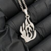 Sterling silver Hebrew flame pendant reading האש שלי (My Fire) on black fabric