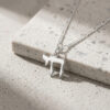 Sterling silver Chai necklace on natural stone, close view of the Hebrew letters Chet and Yud