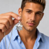 Man holding the sterling silver Star of David pendant with Western Wall engraving to show its size
