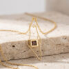 24K gold plated Israel map necklace with Nano Bible on travertine with chain