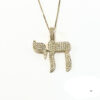 14K yellow gold pavé diamond Chai necklace on a white background