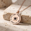 Rose gold plated Nano Bible Eshet Chayil Necklace, round pendant engraved with the Hebrew Eshet Chayil (Woman of Valor) verse around a square nano Bible chip, on stone
