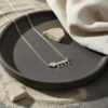 925 sterling silver Hebrew name necklace with birthstone flower on a black stone plate
