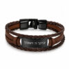 Brown braided leather bracelet with a black stainless steel nameplate engraved with a Hebrew blessing, white background