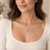14K yellow gold pavé diamond Chai necklace worn by a woman