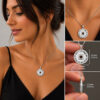 Nano Bible Eshet Chayil Necklace worn by a woman and held in hand, showing the 23 mm pendant size and 1.2 mm thickness