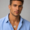 Man in a blue shirt wearing the round Nano Bible Priestly Blessing necklace in sterling silver