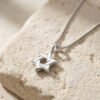 Interlocking sterling silver Star of David pendant detail on a box chain