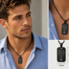 Man wearing the black dog tag necklace with Hebrew engraving over a light blue shirt, with a close-up of the stainless steel pendant