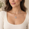 14K white gold pavé diamond Chai necklace worn by a woman