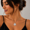 Woman wearing the Nano Bible Eshet Chayil Necklace in sterling silver, Hebrew Woman of Valor pendant with nano Bible chip