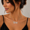 Custom Hebrew Name Necklace worn on the neck, sterling silver personalized Hebrew name pendant styled with a black top