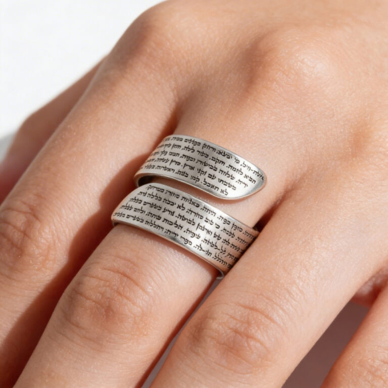Woman's hand wearing a sterling silver Eshet Chayil wrap ring engraved with the Woman of Valor Hebrew text