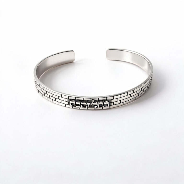 sterling silver Jerusalem Wall cuff bracelet with Hebrew engraving on a white background