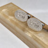 Sterling silver Western Wall cufflinks with a Hebrew name resting on a polished stone bar