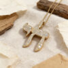 14K yellow gold pavé diamond Chai necklace on stone with olive wood