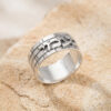 Close view of a sterling silver Jerusalem Wall ring engraved with the Hebrew name Naomi, on Jerusalem stone