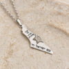 Close view of the sterling silver Israel map pendant with the Hebrew words Am Yisrael Chai engraved