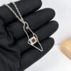 925 sterling silver Israel map necklace with Nano Bible held in a black-gloved hand