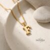 14K Gold Dainty Initial Necklace Tiny Letter Charm — top-down view, handmade in Israel