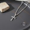 Cubic zirconia stone setting detail on cross pendant.