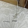 Cross Necklace size reference on neckline.