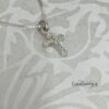 Sterling Silver pavé cross presented in gift box.