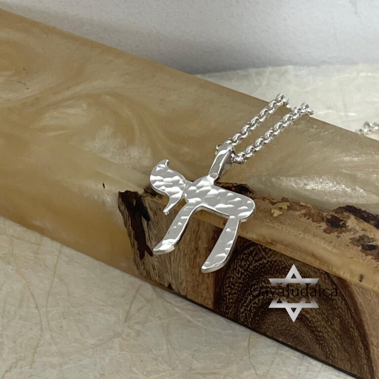Hammered Chai pendant macro detail — life symbol.