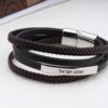 Braided Leather Bracelet with Hebrew Engraving — top-down view, handmade in Israel