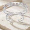 Couple Roman Numeral Cuff Bangle Set of Two — dark surface composition, handmade in Israel