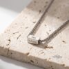 Custom Cuboid Hebrew Necklace Stainless Steel — top-down view, handmade in Israel