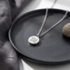 Custom Engraved Round Stainless Steel Pendant Necklace — natural light shot, handmade in Israel