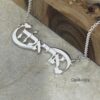 Hebrew Name Infinity Necklace — dark surface composition, handmade in Israel