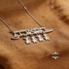 Hebrew Name Necklace with Baby Charms — natural light shot, handmade in Israel