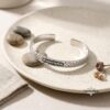 Sterling Silver Jerusalem Wall Cuff Bracelet Engraved — close-up detail, handmade in Israel