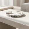 Sterling Silver Jerusalem Wall Cuff Bracelet Engraved — styled shot, handmade in Israel