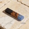 Olive Wood Mezuzah Case Blue and Black Epoxy — dark surface composition, handmade in Israel