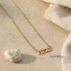 Tiny Hebrew Name Necklace Sterling Silver — top-down view, handmade in Israel