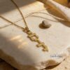 14K Gold Vertical Hebrew Name Necklace — styled shot, handmade in Israel
