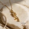14K Gold Vertical Hebrew Name Necklace — natural light shot, handmade in Israel