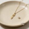14K Gold Vertical Hebrew Name Necklace — warm-tone styled, handmade in Israel