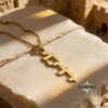 14K Gold Vertical Hebrew Name Necklace — dark surface composition, handmade in Israel