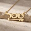 Close-up of personalized Hebrew name necklace in 14K yellow gold